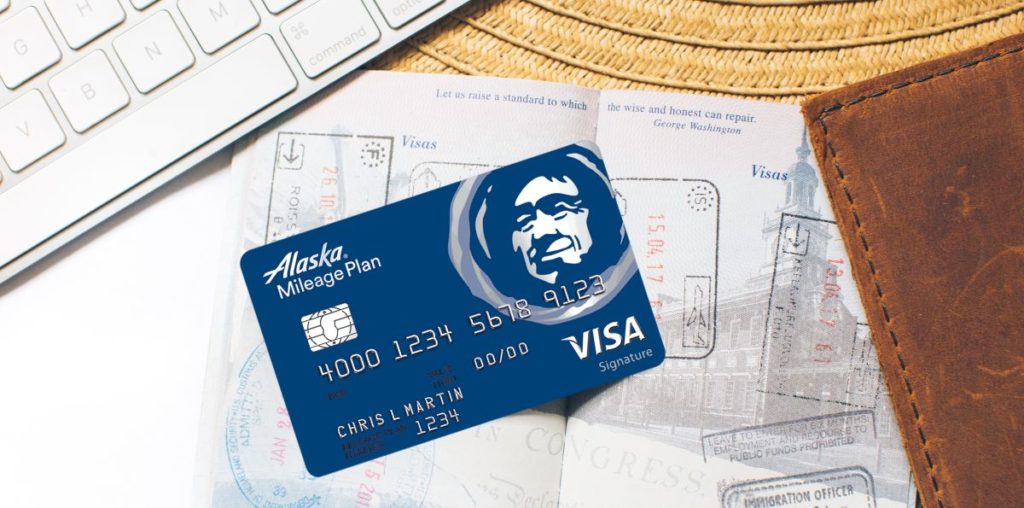 Alaska Airlines credit card on top of a passport