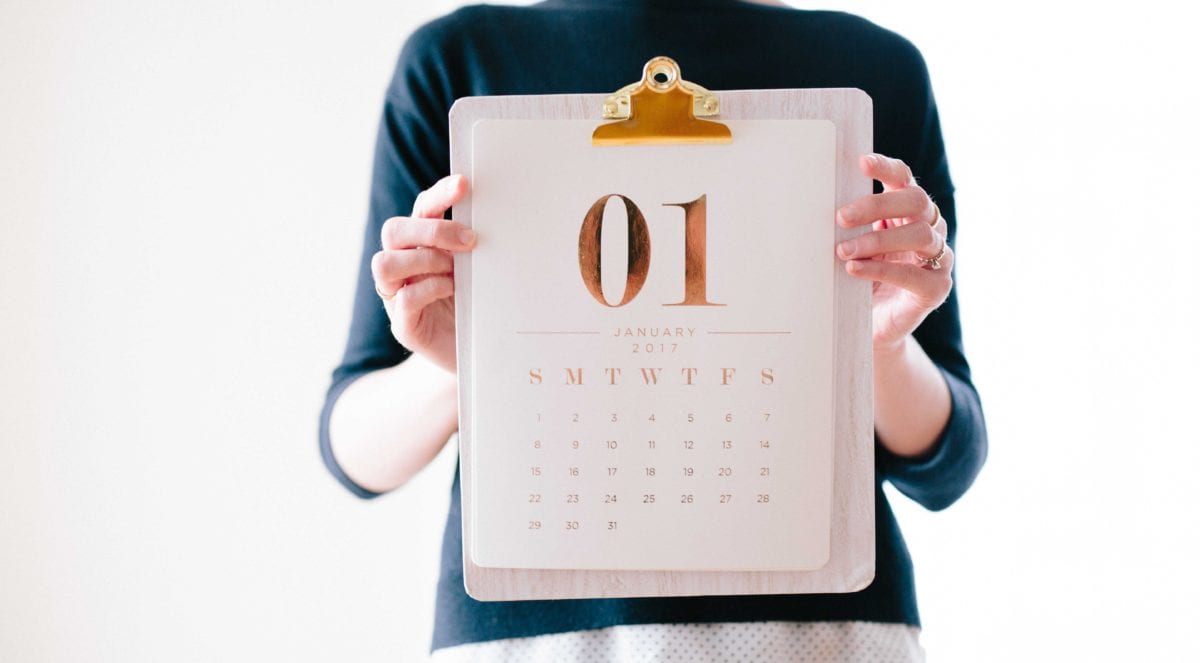 a person holding a calendar