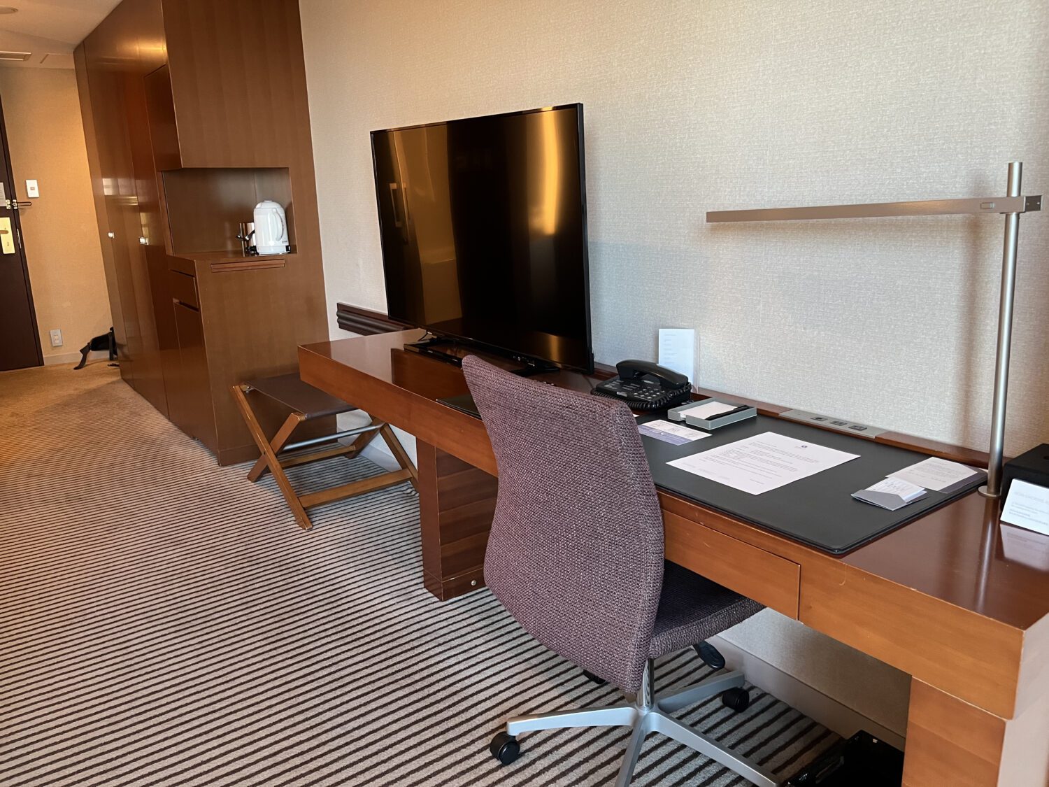 Office chair, desk, and TV at Hyatt Tokyo