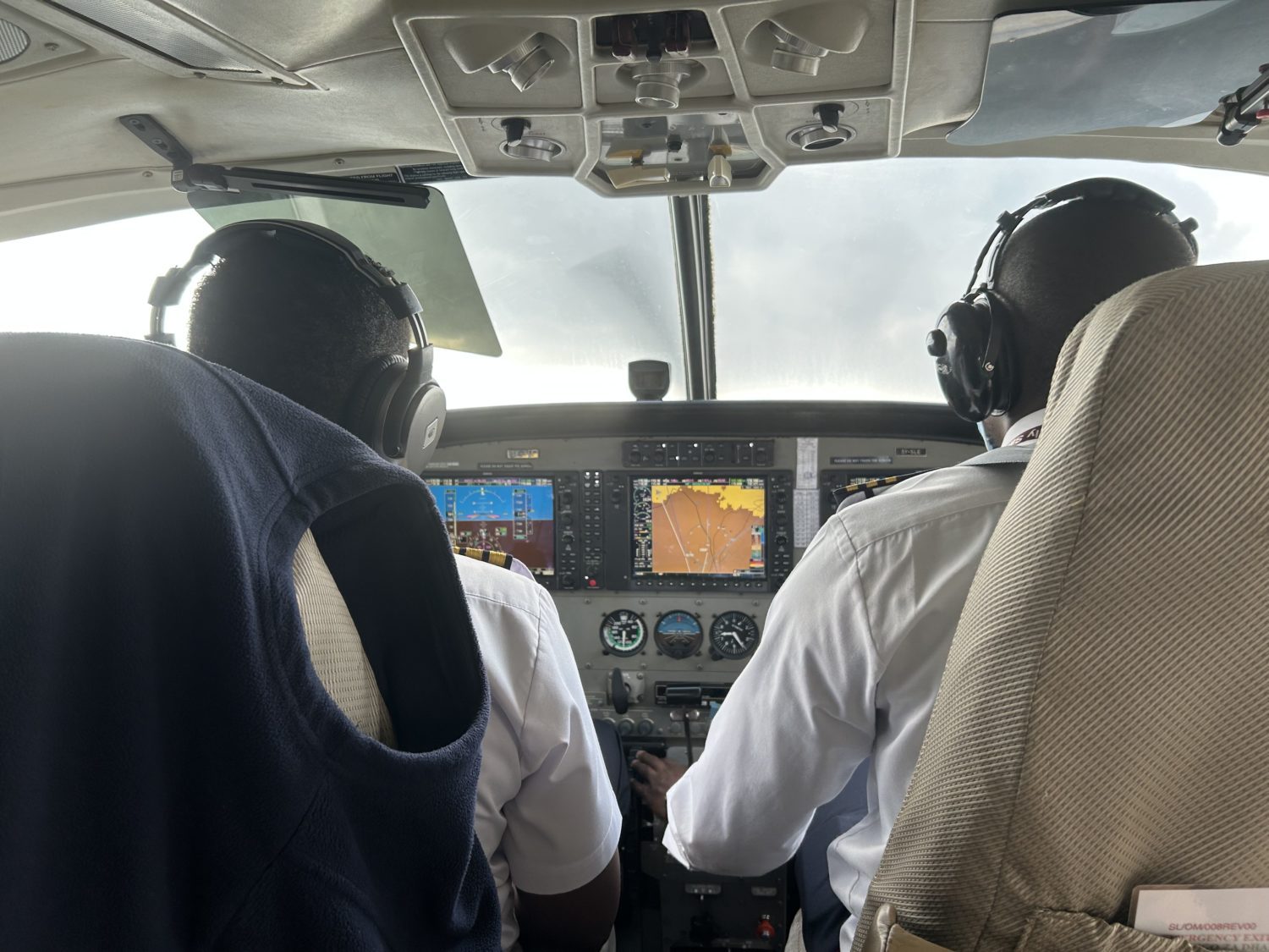 view of the cockpit with pilots flying